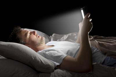 Reading a smartphone in bed photo